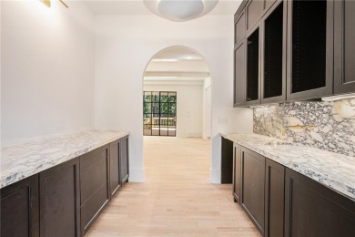 Set on a sprawling 1-acre lot in an established, tree-lined on Dunwoody Country Club in Georgia - for sale on GolfHomes.com, golf home, golf lot