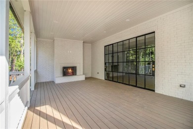 Set on a sprawling 1-acre lot in an established, tree-lined on Dunwoody Country Club in Georgia - for sale on GolfHomes.com, golf home, golf lot