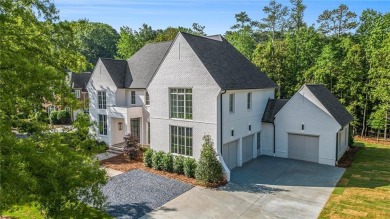 Set on a sprawling 1-acre lot in an established, tree-lined on Dunwoody Country Club in Georgia - for sale on GolfHomes.com, golf home, golf lot
