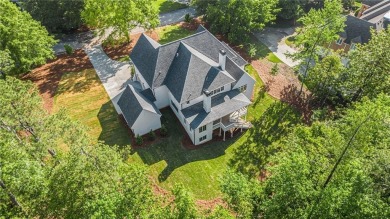 Set on a sprawling 1-acre lot in an established, tree-lined on Dunwoody Country Club in Georgia - for sale on GolfHomes.com, golf home, golf lot