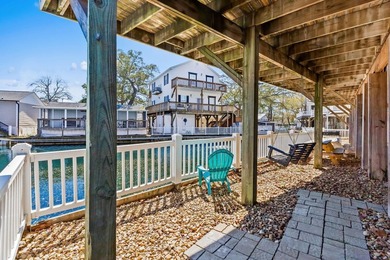 STUNNING 4 BED/4 BATH LAKEFRONT RAISED BEACH HOUSE WITH TONS OF on Prestwick Country Club in South Carolina - for sale on GolfHomes.com, golf home, golf lot