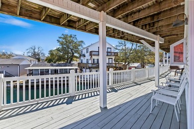 STUNNING 4 BED/4 BATH LAKEFRONT RAISED BEACH HOUSE WITH TONS OF on Prestwick Country Club in South Carolina - for sale on GolfHomes.com, golf home, golf lot