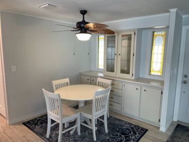 TIRED OF SNOW,ICE AND COLD, TRADE IT IN FOR SUN,WARM AND WHITE on Lake Fairways Country Club in Florida - for sale on GolfHomes.com, golf home, golf lot