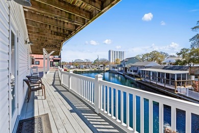 STUNNING 4 BED/4 BATH LAKEFRONT RAISED BEACH HOUSE WITH TONS OF on Prestwick Country Club in South Carolina - for sale on GolfHomes.com, golf home, golf lot