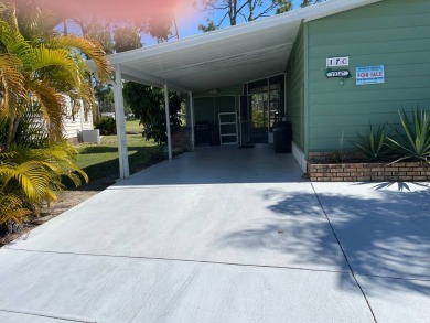 TIRED OF SNOW,ICE AND COLD, TRADE IT IN FOR SUN,WARM AND WHITE on Lake Fairways Country Club in Florida - for sale on GolfHomes.com, golf home, golf lot