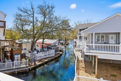 STUNNING 4 BED/4 BATH LAKEFRONT RAISED BEACH HOUSE WITH TONS OF on Prestwick Country Club in South Carolina - for sale on GolfHomes.com, golf home, golf lot