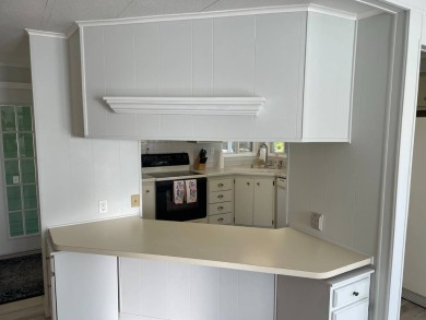TIRED OF SNOW,ICE AND COLD, TRADE IT IN FOR SUN,WARM AND WHITE on Lake Fairways Country Club in Florida - for sale on GolfHomes.com, golf home, golf lot
