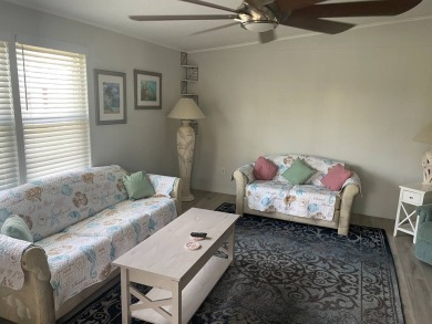 TIRED OF SNOW,ICE AND COLD, TRADE IT IN FOR SUN,WARM AND WHITE on Lake Fairways Country Club in Florida - for sale on GolfHomes.com, golf home, golf lot