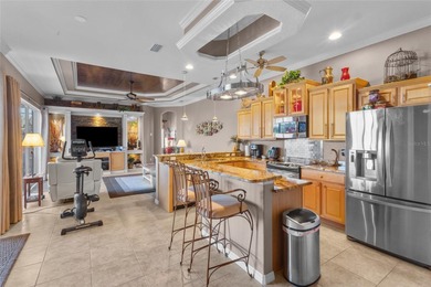 Enjoy the charm of this Italian villa-inspired, beautifully on Stoneybrook Golf Club At Heritage Harbour in Florida - for sale on GolfHomes.com, golf home, golf lot