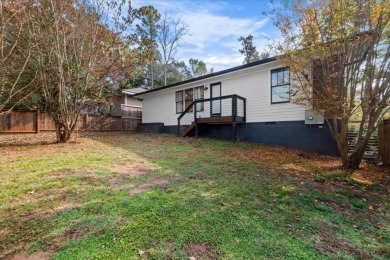 Welcome to your dream home on a sprawling corner lot in East on East Lake Golf Club in Georgia - for sale on GolfHomes.com, golf home, golf lot