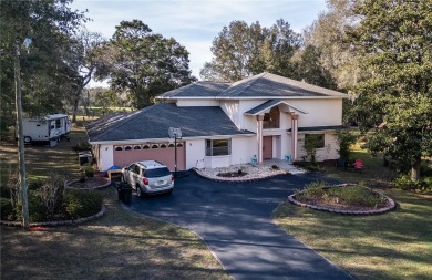 Welcome to this two story, 4 bedrooms and 3.5 bathroom home on Citrus Springs Country Club in Florida - for sale on GolfHomes.com, golf home, golf lot