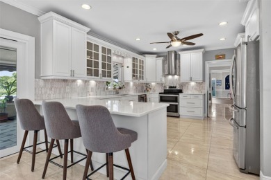Timeless architecture meets refined modern living in this on Feather Sound Country Club in Florida - for sale on GolfHomes.com, golf home, golf lot