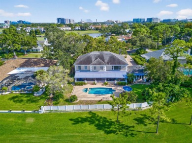 Under contract-accepting backup offers. Timeless architecture on Feather Sound Country Club in Florida - for sale on GolfHomes.com, golf home, golf lot