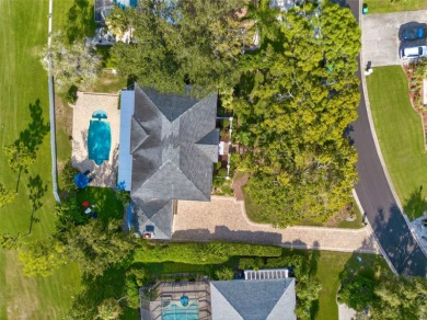 Under contract-accepting backup offers. Timeless architecture on Feather Sound Country Club in Florida - for sale on GolfHomes.com, golf home, golf lot