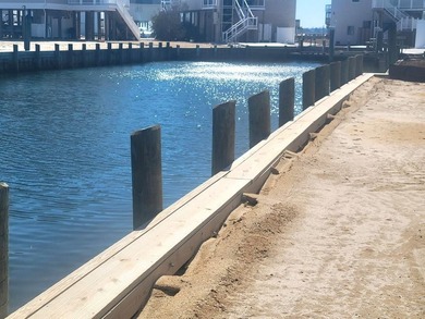 Breathtaking views of the Chincoteague Bay, a front row seat to on Captains Cove Golf and Yacht Club in Virginia - for sale on GolfHomes.com, golf home, golf lot