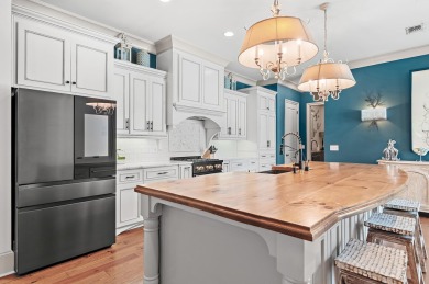 Step into a home that feels like a private resort--where indoor on Regatta Bay Golf and Country Club in Florida - for sale on GolfHomes.com, golf home, golf lot