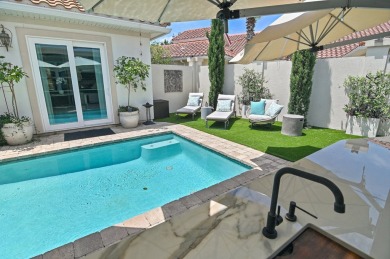 Step into a home that feels like a private resort--where indoor on Regatta Bay Golf and Country Club in Florida - for sale on GolfHomes.com, golf home, golf lot