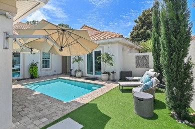 Step into a home that feels like a private resort--where indoor on Regatta Bay Golf and Country Club in Florida - for sale on GolfHomes.com, golf home, golf lot