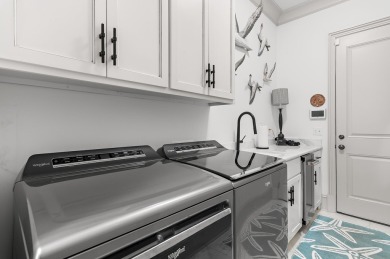Step into a home that feels like a private resort--where indoor on Regatta Bay Golf and Country Club in Florida - for sale on GolfHomes.com, golf home, golf lot