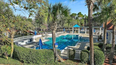 Step into a home that feels like a private resort--where indoor on Regatta Bay Golf and Country Club in Florida - for sale on GolfHomes.com, golf home, golf lot
