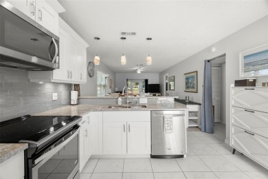 Under contract-accepting backup offers. Beautifully renovated on Seven Springs Golf and Country Club in Florida - for sale on GolfHomes.com, golf home, golf lot