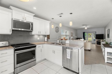 Under contract-accepting backup offers. Beautifully renovated on Seven Springs Golf and Country Club in Florida - for sale on GolfHomes.com, golf home, golf lot