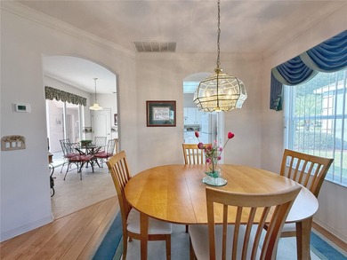 This St. Ives floor plan with screened in LANDSCAPED courtyard on Kings Ridge Golf Club in Florida - for sale on GolfHomes.com, golf home, golf lot