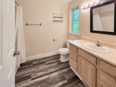 This low-maintenance 3-bedroom, 2-bath home features a bright on Michaywe Pines Course in Michigan - for sale on GolfHomes.com, golf home, golf lot