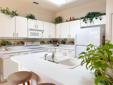 This St. Ives floor plan with screened in LANDSCAPED courtyard on Kings Ridge Golf Club in Florida - for sale on GolfHomes.com, golf home, golf lot