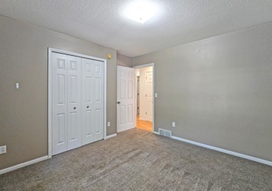This low-maintenance 3-bedroom, 2-bath home features a bright on Michaywe Pines Course in Michigan - for sale on GolfHomes.com, golf home, golf lot