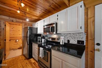 Welcome to Grin and Bear It. This amazing three bedroom, two and on Bent Creek Golf Course in Tennessee - for sale on GolfHomes.com, golf home, golf lot