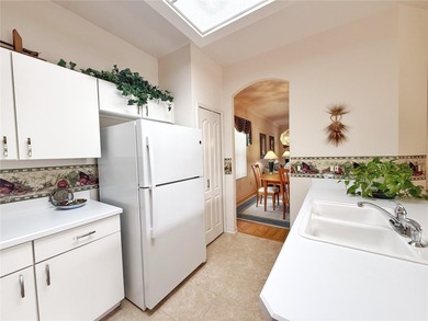 This St. Ives floor plan with screened in LANDSCAPED courtyard on Kings Ridge Golf Club in Florida - for sale on GolfHomes.com, golf home, golf lot