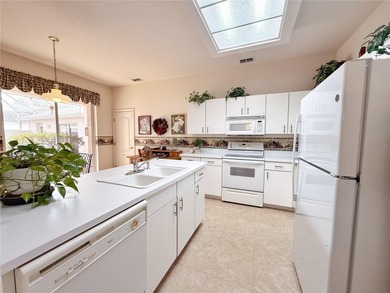 This St. Ives floor plan with screened in LANDSCAPED courtyard on Kings Ridge Golf Club in Florida - for sale on GolfHomes.com, golf home, golf lot