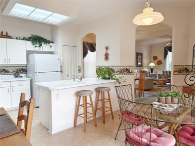 This St. Ives floor plan with screened in LANDSCAPED courtyard on Kings Ridge Golf Club in Florida - for sale on GolfHomes.com, golf home, golf lot