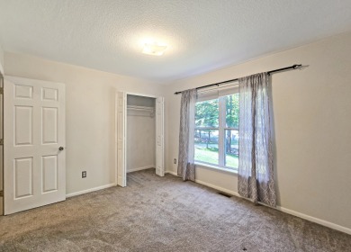 This low-maintenance 3-bedroom, 2-bath home features a bright on Michaywe Pines Course in Michigan - for sale on GolfHomes.com, golf home, golf lot