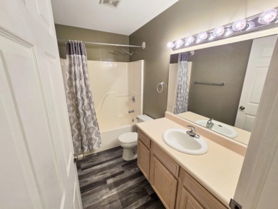 This low-maintenance 3-bedroom, 2-bath home features a bright on Michaywe Pines Course in Michigan - for sale on GolfHomes.com, golf home, golf lot