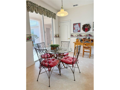 This St. Ives floor plan with screened in LANDSCAPED courtyard on Kings Ridge Golf Club in Florida - for sale on GolfHomes.com, golf home, golf lot