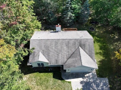 This low-maintenance 3-bedroom, 2-bath home features a bright on Michaywe Pines Course in Michigan - for sale on GolfHomes.com, golf home, golf lot