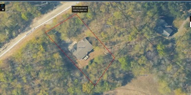 This low-maintenance 3-bedroom, 2-bath home features a bright on Michaywe Pines Course in Michigan - for sale on GolfHomes.com, golf home, golf lot