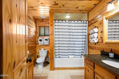 Welcome to Grin and Bear It. This amazing three bedroom, two and on Bent Creek Golf Course in Tennessee - for sale on GolfHomes.com, golf home, golf lot
