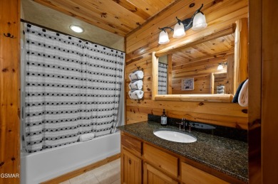 Welcome to Grin and Bear It. This amazing three bedroom, two and on Bent Creek Golf Course in Tennessee - for sale on GolfHomes.com, golf home, golf lot