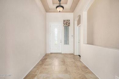 Set on a huge, nearly 12,000-square-foot lot backing to pristine on Estrella Mountain Ranch Golf Course in Arizona - for sale on GolfHomes.com, golf home, golf lot