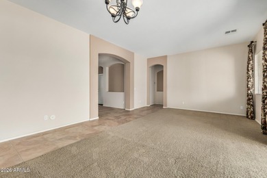 Set on a huge, nearly 12,000-square-foot lot backing to pristine on Estrella Mountain Ranch Golf Course in Arizona - for sale on GolfHomes.com, golf home, golf lot