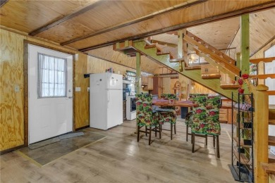 Enjoy lakeside living with this charming and move-in ready cabin on Sugar Valley Lakes Golf Course in Kansas - for sale on GolfHomes.com, golf home, golf lot