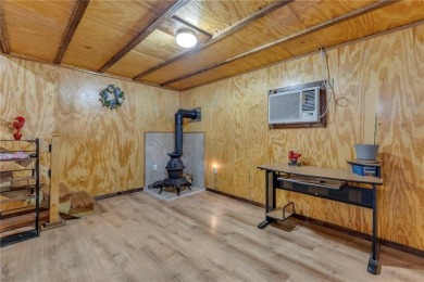 Enjoy lakeside living with this charming and move-in ready cabin on Sugar Valley Lakes Golf Course in Kansas - for sale on GolfHomes.com, golf home, golf lot