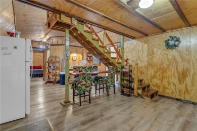 Enjoy lakeside living with this charming and move-in ready cabin on Sugar Valley Lakes Golf Course in Kansas - for sale on GolfHomes.com, golf home, golf lot