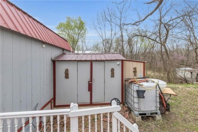 Enjoy lakeside living with this charming and move-in ready cabin on Sugar Valley Lakes Golf Course in Kansas - for sale on GolfHomes.com, golf home, golf lot