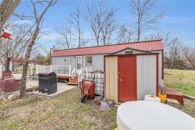 Enjoy lakeside living with this charming and move-in ready cabin on Sugar Valley Lakes Golf Course in Kansas - for sale on GolfHomes.com, golf home, golf lot