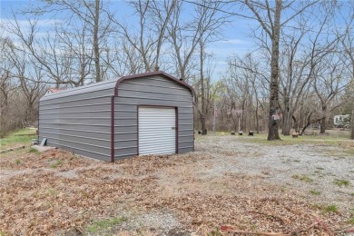 Enjoy lakeside living with this charming and move-in ready cabin on Sugar Valley Lakes Golf Course in Kansas - for sale on GolfHomes.com, golf home, golf lot