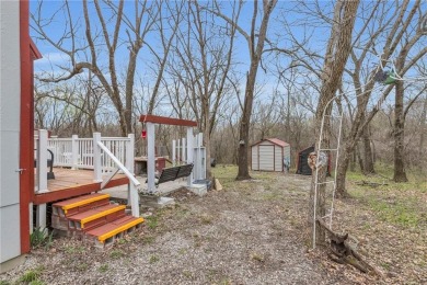Enjoy lakeside living with this charming and move-in ready cabin on Sugar Valley Lakes Golf Course in Kansas - for sale on GolfHomes.com, golf home, golf lot